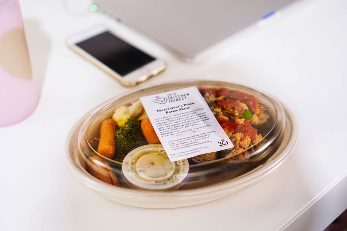 Meal prep container with protein and vegetables ready to be reheated